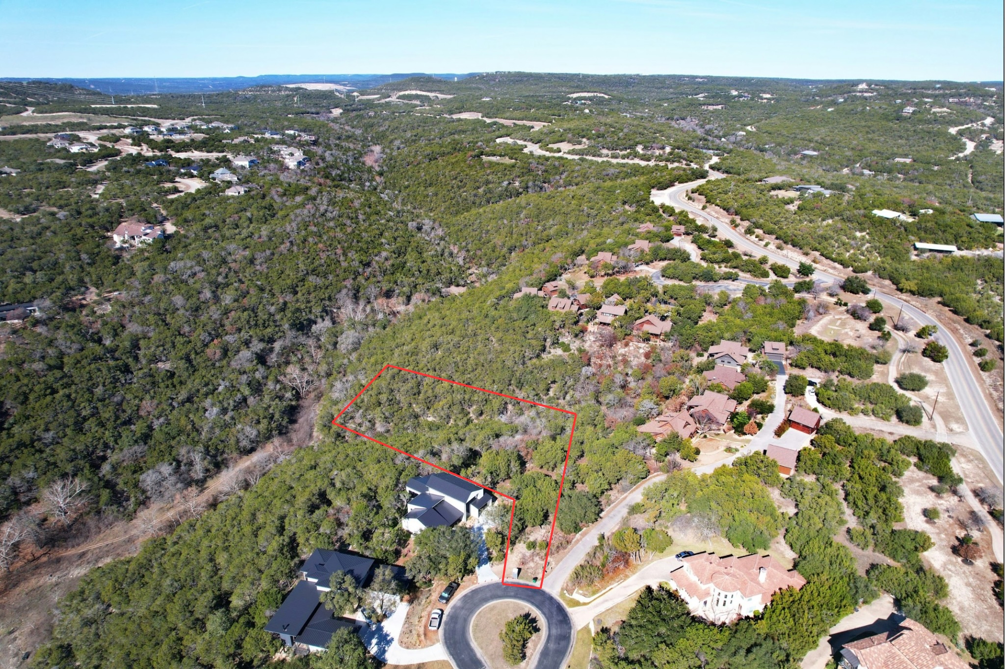 18849 Hidden Ridge Place Jonestown, TX 78645 - Photo 2 of 14 an aerial view of residential houses with outdoor space