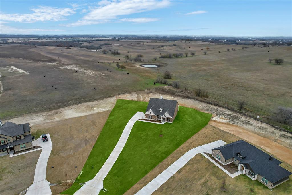 an aerial view of a house with beach