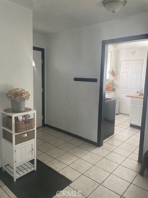 44329 3rd Street East Lancaster, CA 93535 - Photo 4 of 13 a room with a table and white cabinets