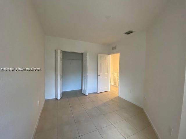 2708 Southwest 83rd Avenue, Unit 105 Miramar, FL 33025 - Photo 12 of 15 a view of an empty room with a window