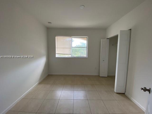 2708 Southwest 83rd Avenue, Unit 105 Miramar, FL 33025 - Photo 13 of 15 a view of an empty room with a window
