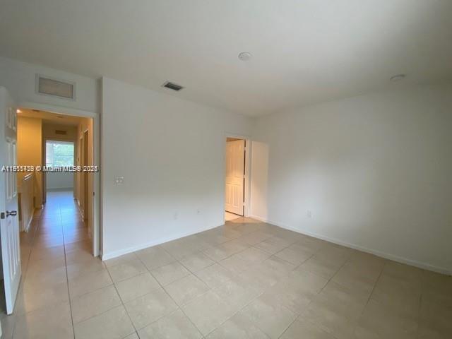 2708 Southwest 83rd Avenue, Unit 105 Miramar, FL 33025 - Photo 6 of 15 a view of an empty room and window