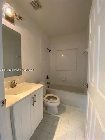 2708 Southwest 83rd Avenue, Unit 105 Miramar, FL 33025 - Photo 7 of 15 a bathroom with a sink a toilet and shower