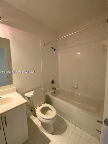 2708 Southwest 83rd Avenue, Unit 105 Miramar, FL 33025 - Photo 9 of 15 a bathroom with a toilet a sink and bathtub
