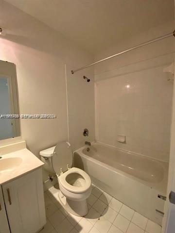 2708 Southwest 83rd Avenue, Unit 105 Miramar, FL 33025 - Photo 9 of 15 a bathroom with a toilet a sink and bathtub