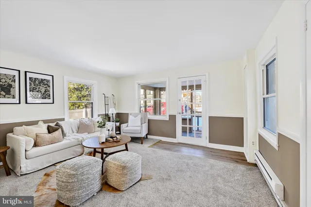 a living room with furniture and window