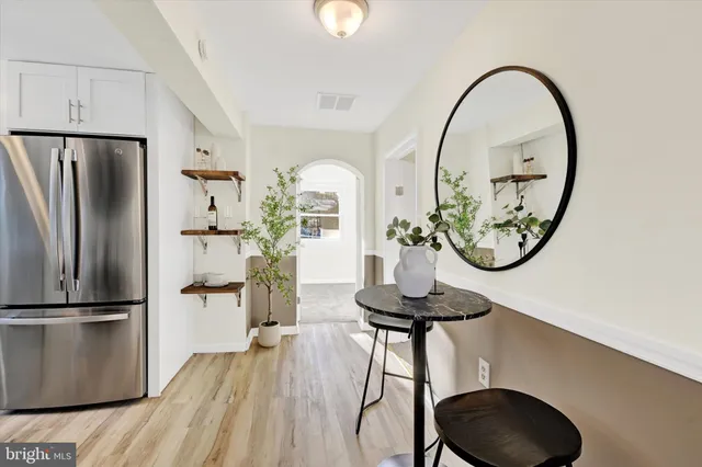a view of a livingroom with furniture and a mirror