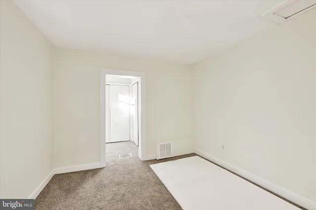 an empty room with a bench