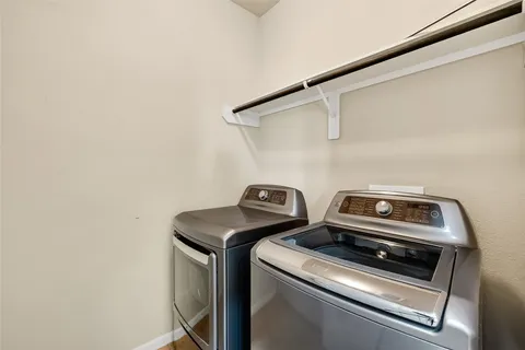 a view of a house with backyard and a garden