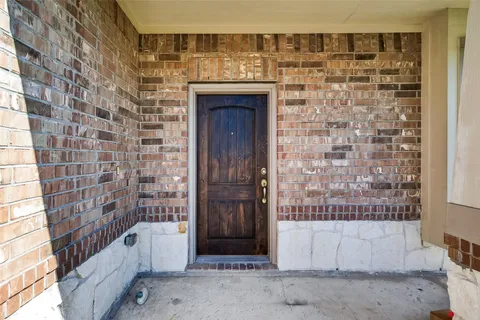 a view of a hallway with entryway