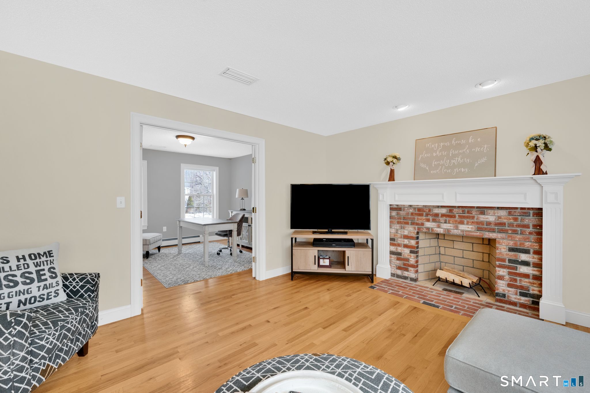 23 Neville Street Coventry, CT 06238 - Photo 12 of 40 a living room with furniture and a flat screen tv