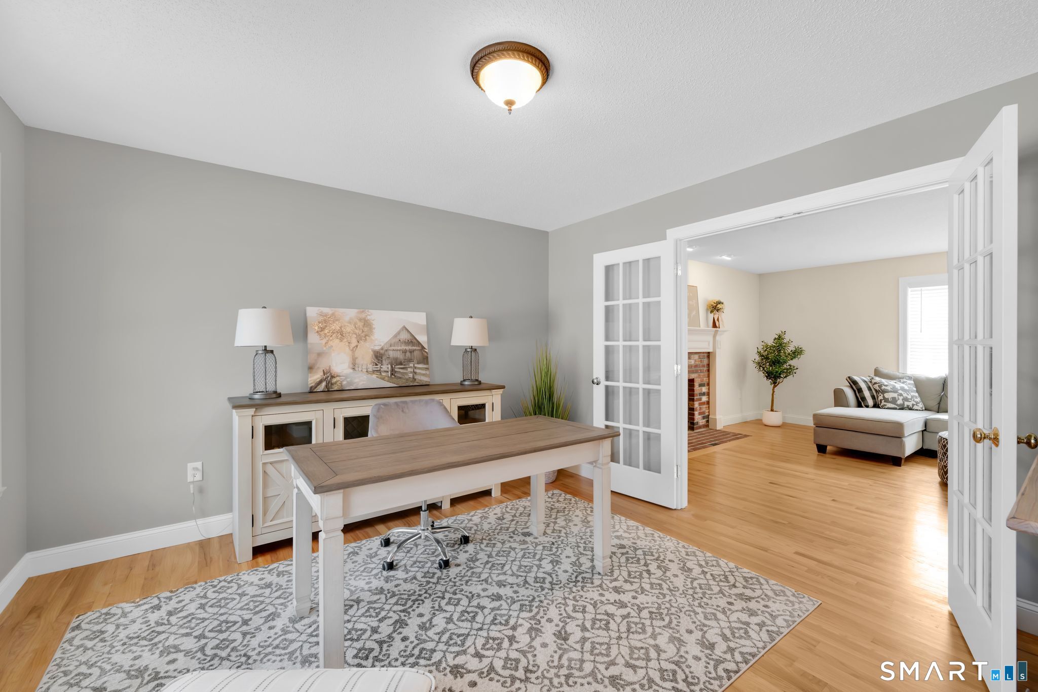 23 Neville Street Coventry, CT 06238 - Photo 14 of 40 a living room with a couch and a table