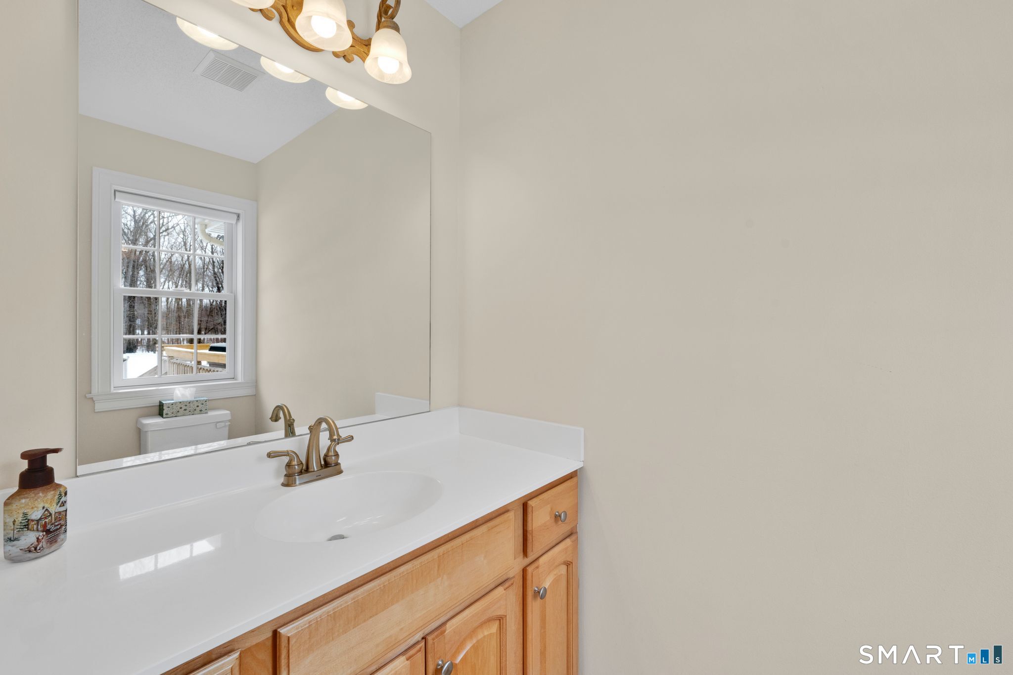 23 Neville Street Coventry, CT 06238 - Photo 18 of 40 a bathroom with a sink and a mirror