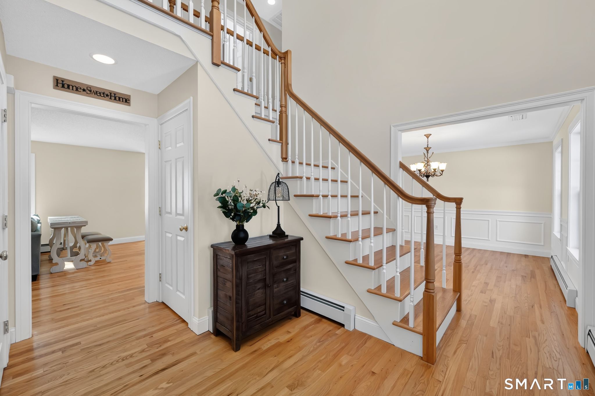 23 Neville Street Coventry, CT 06238 - Photo 19 of 40 a view of entryway with wooden floor and stairs