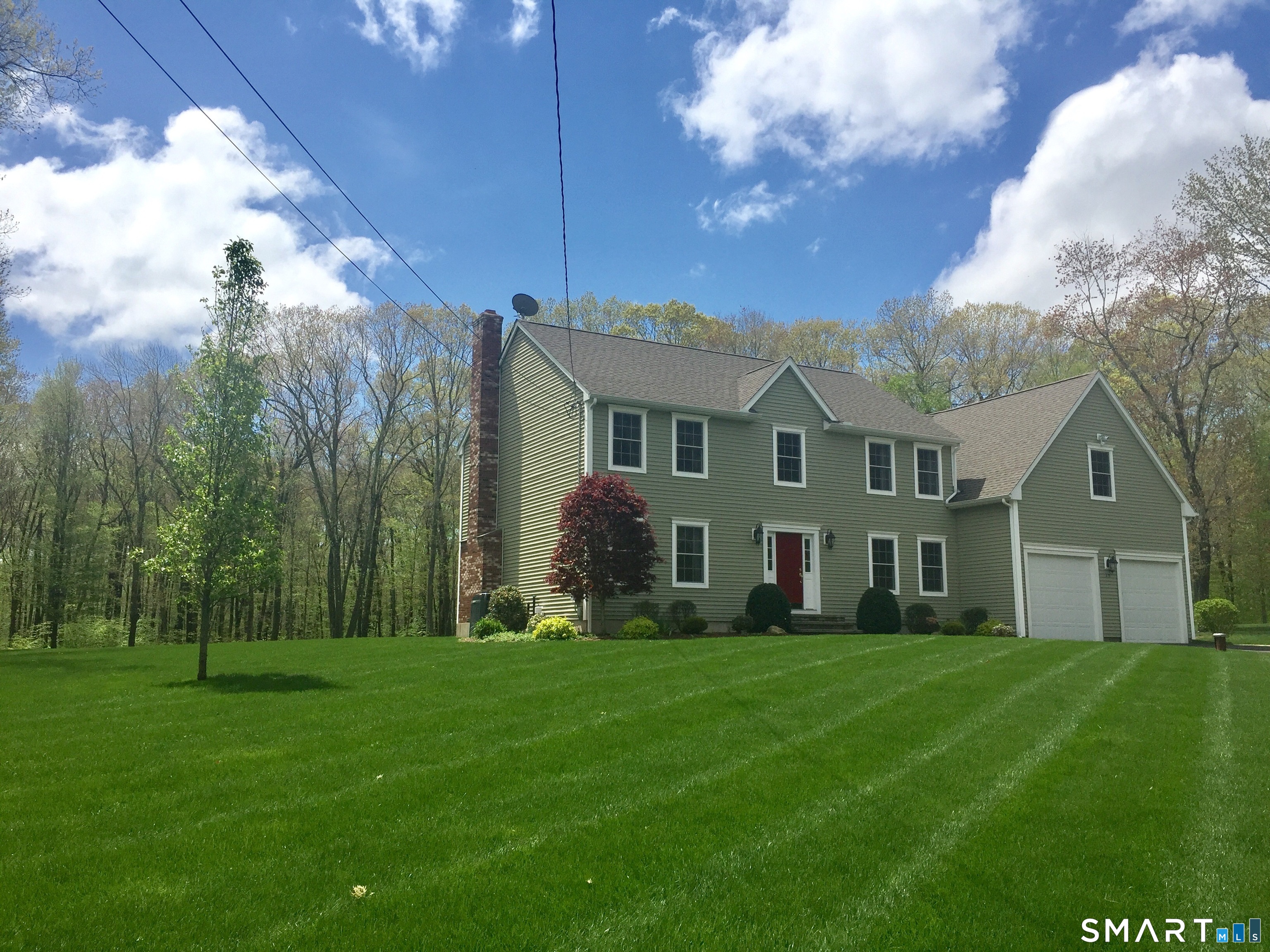 23 Neville Street Coventry, CT 06238 - Photo 2 of 40 a front view of a house with a yard