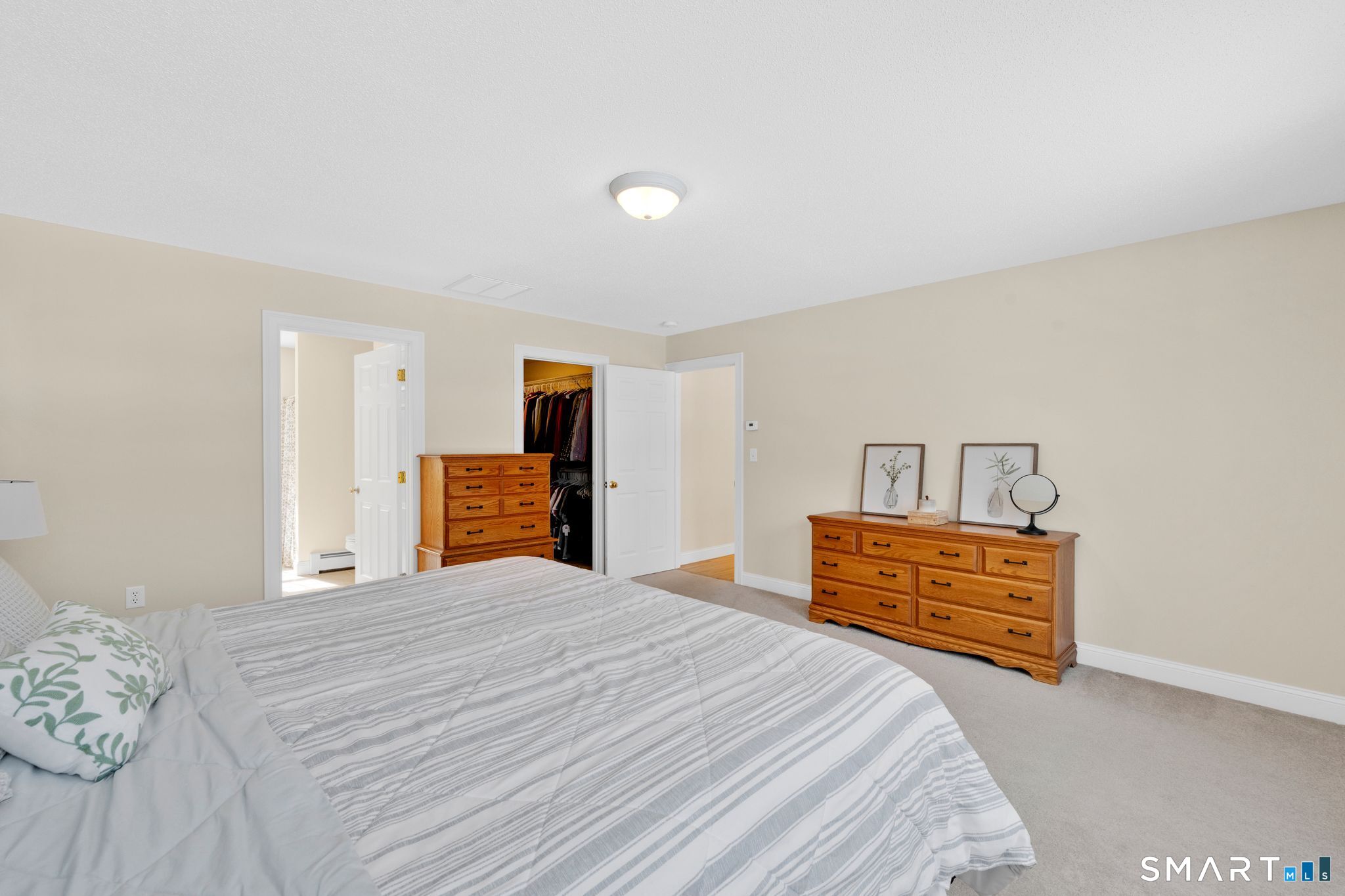 23 Neville Street Coventry, CT 06238 - Photo 25 of 40 a bedroom with a bed and a dresser