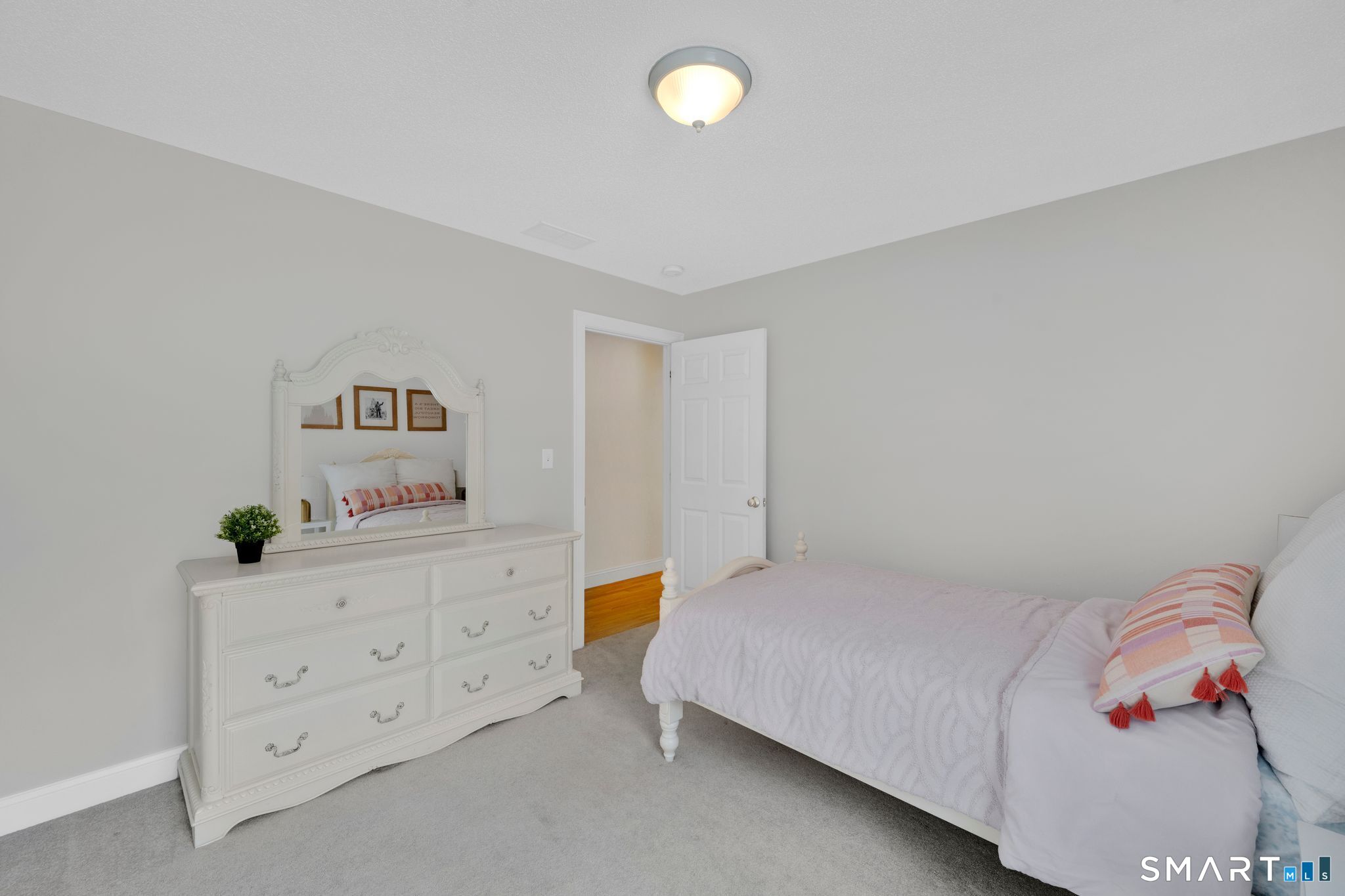 23 Neville Street Coventry, CT 06238 - Photo 28 of 40 a bedroom with a bed and cabinets