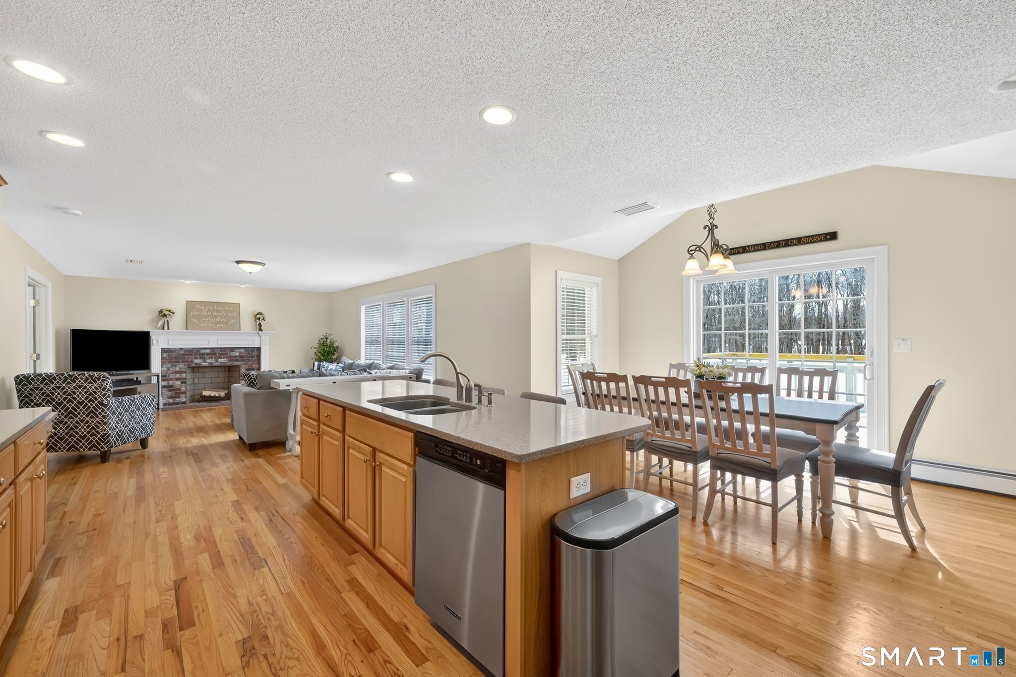 23 Neville Street Coventry, CT 06238 - Photo 3 of 40 a kitchen with stainless steel appliances granite countertop a stove and a wooden floors