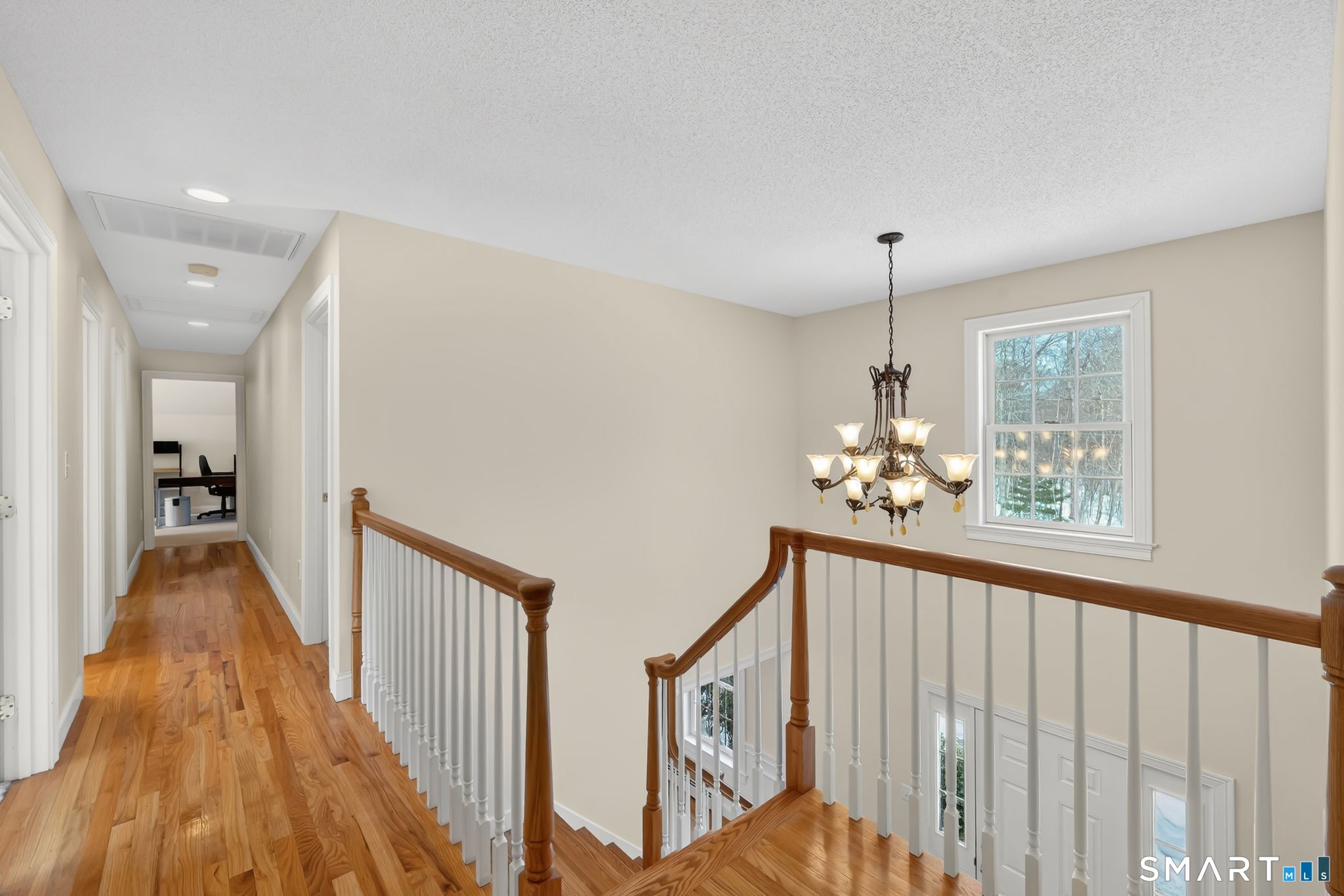 23 Neville Street Coventry, CT 06238 - Photo 33 of 40 a view of a hallway view with wooden floor and staircase