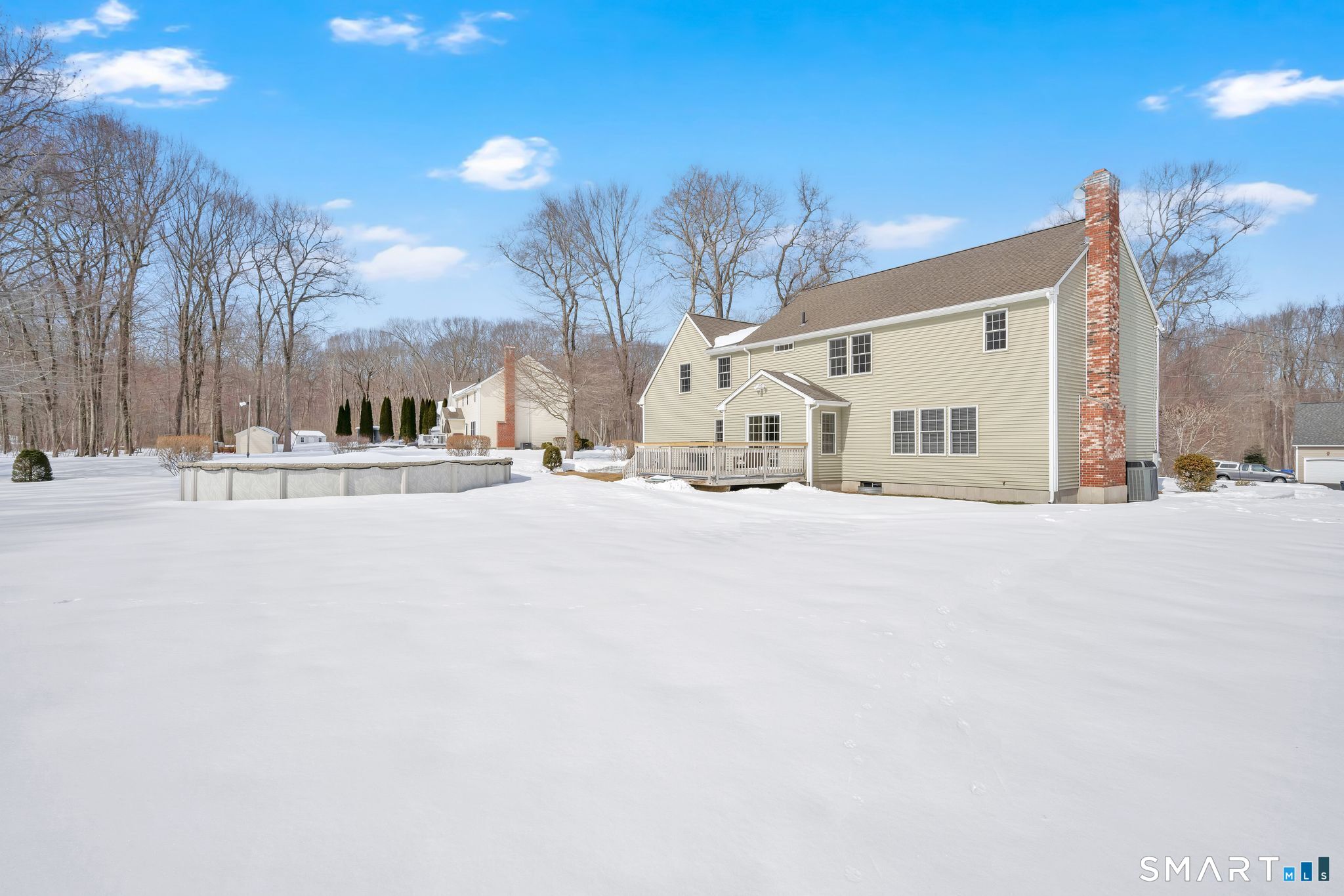 23 Neville Street Coventry, CT 06238 - Photo 36 of 40 a view of white house with a snow on the road