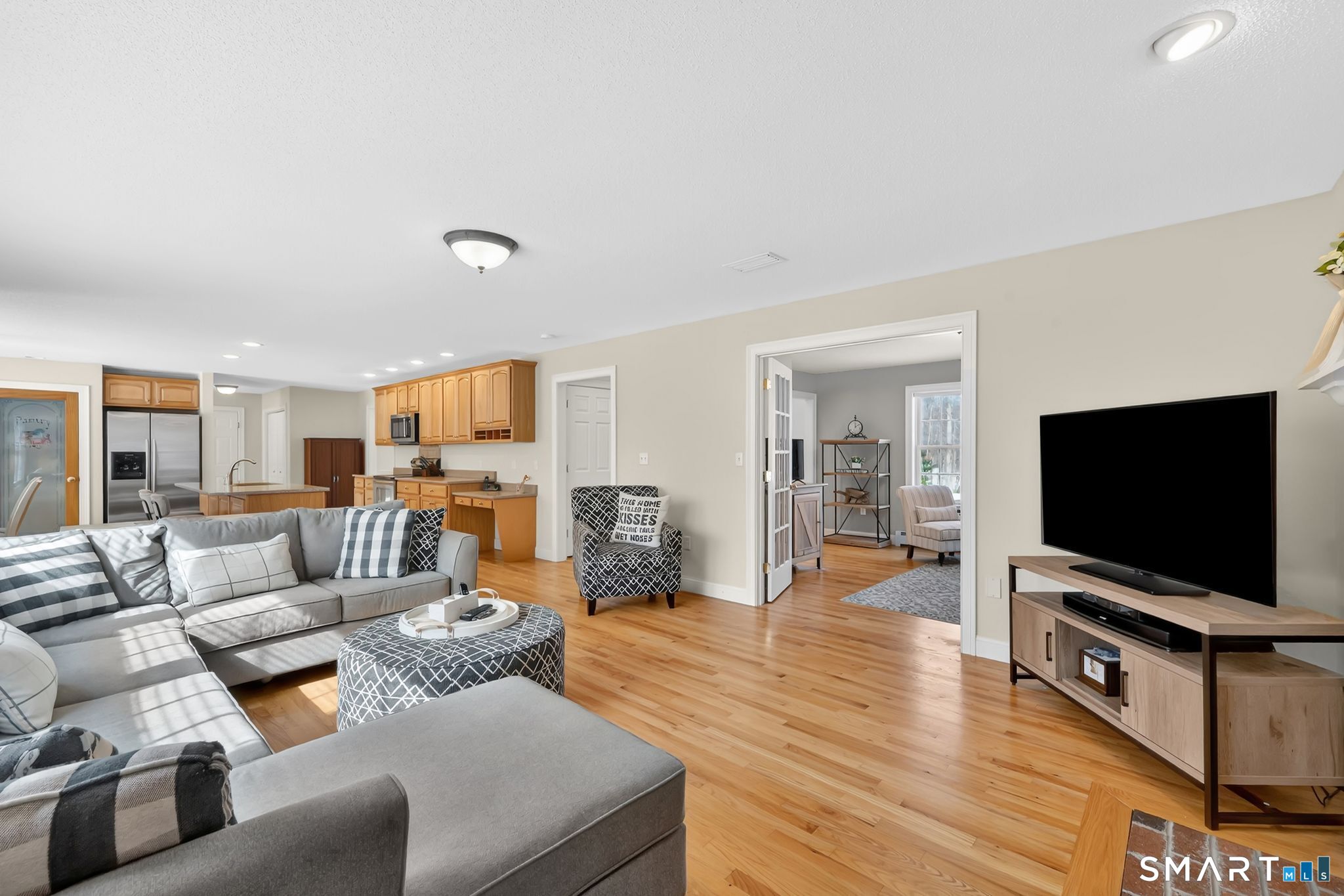 23 Neville Street Coventry, CT 06238 - Photo 9 of 40 a living room with furniture and a flat screen tv
