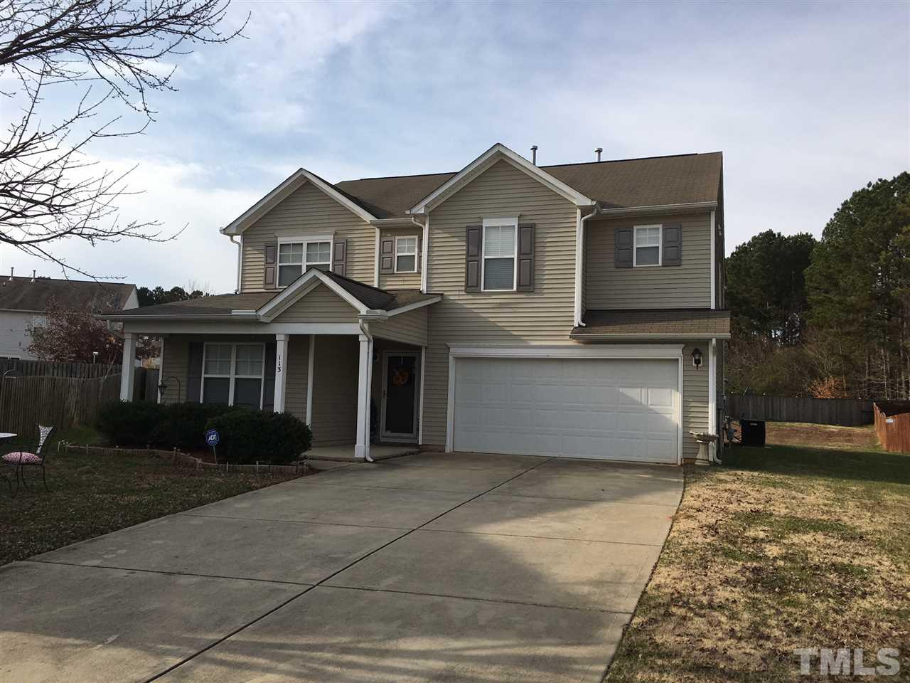 113 Dabney Ridge Place Garner, NC 27529 - Photo 1 of 4 a front view of a house with yard