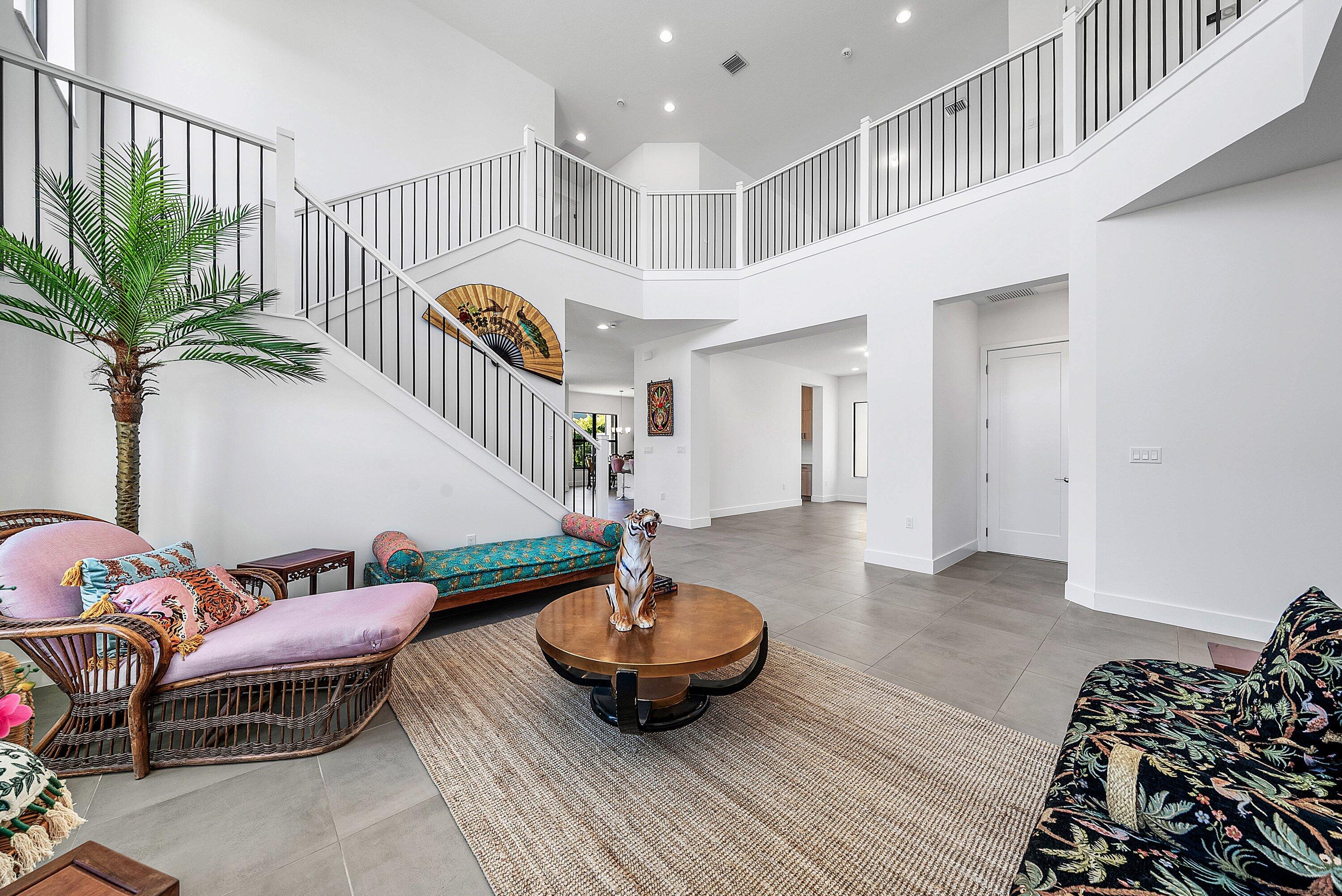 8260 Royal County Down Road Boca Raton, FL 33434 - Photo 12 of 115 a living room with furniture and a potted plant