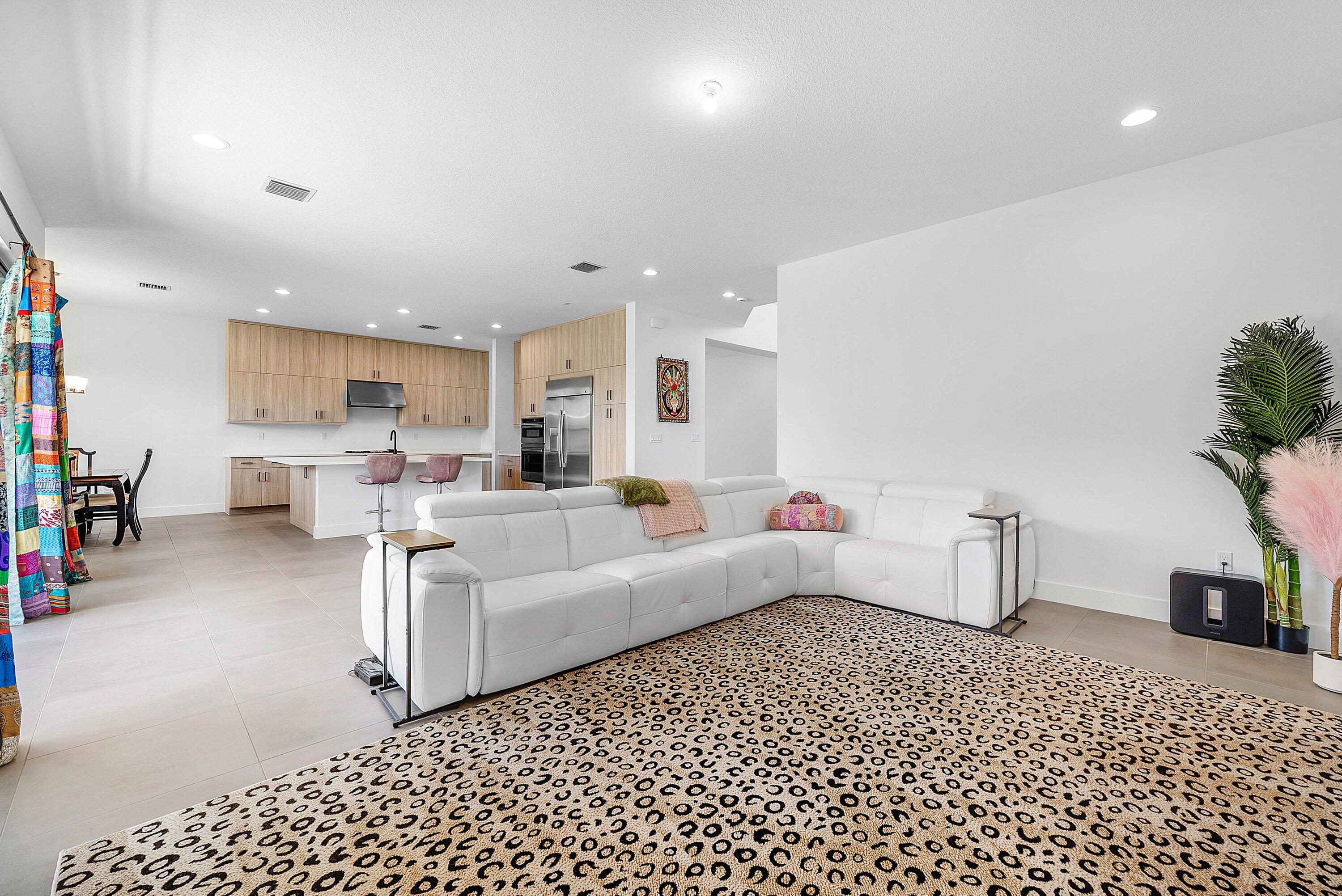 8260 Royal County Down Road Boca Raton, FL 33434 - Photo 24 of 115 a living room with furniture and a lamp