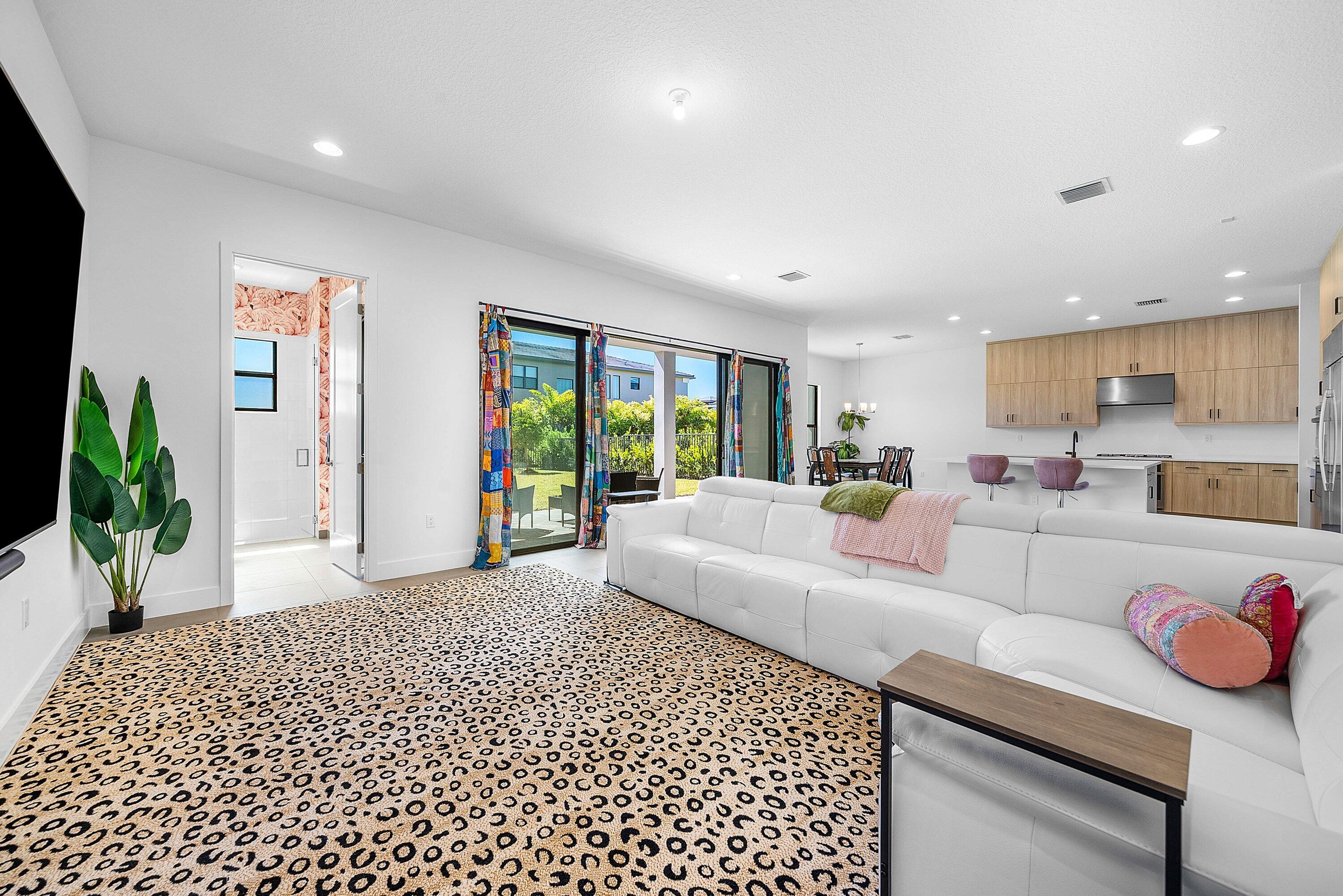 8260 Royal County Down Road Boca Raton, FL 33434 - Photo 25 of 115 a living room with furniture and a large window