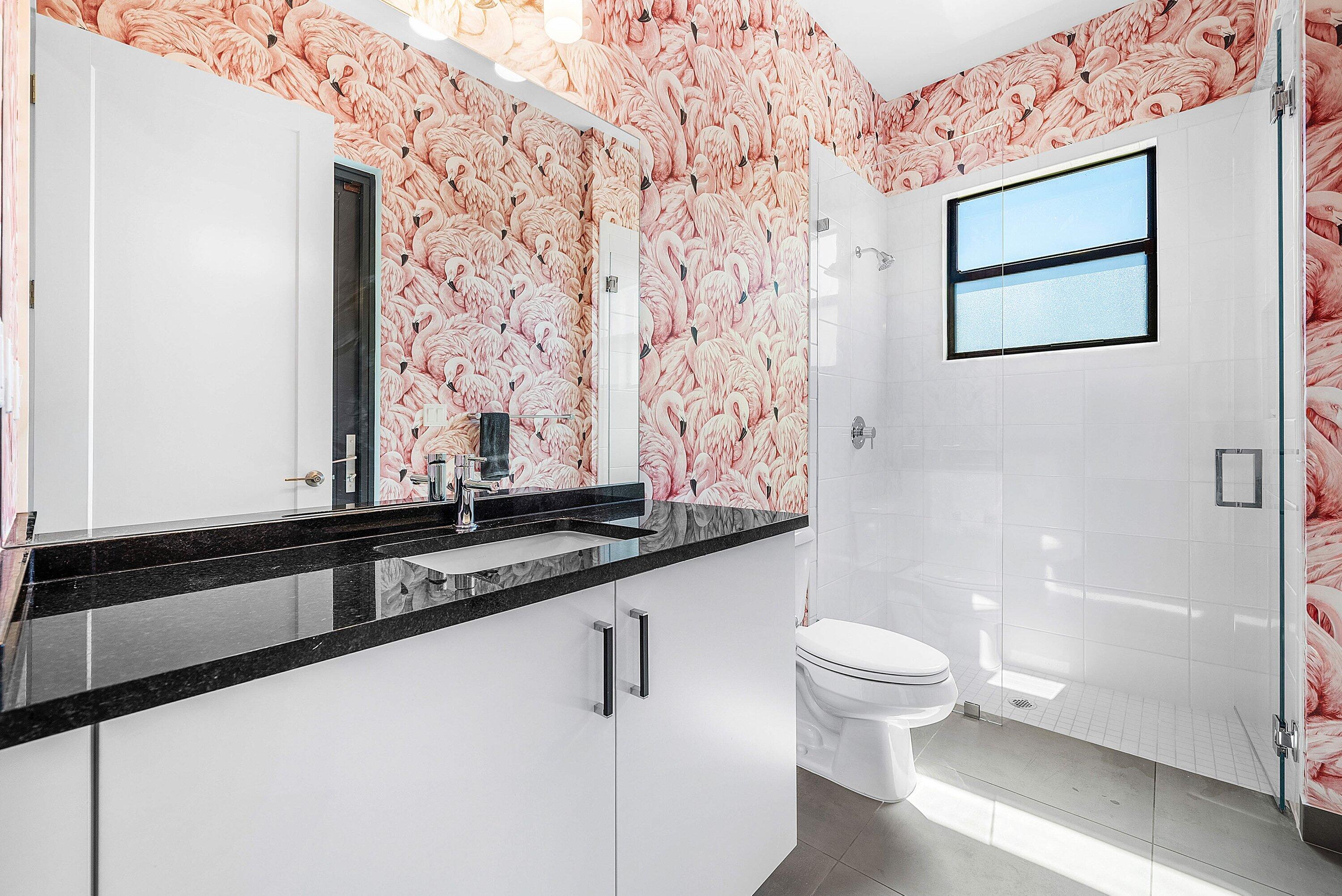 8260 Royal County Down Road Boca Raton, FL 33434 - Photo 26 of 115 a bathroom with a granite countertop sink and a mirror