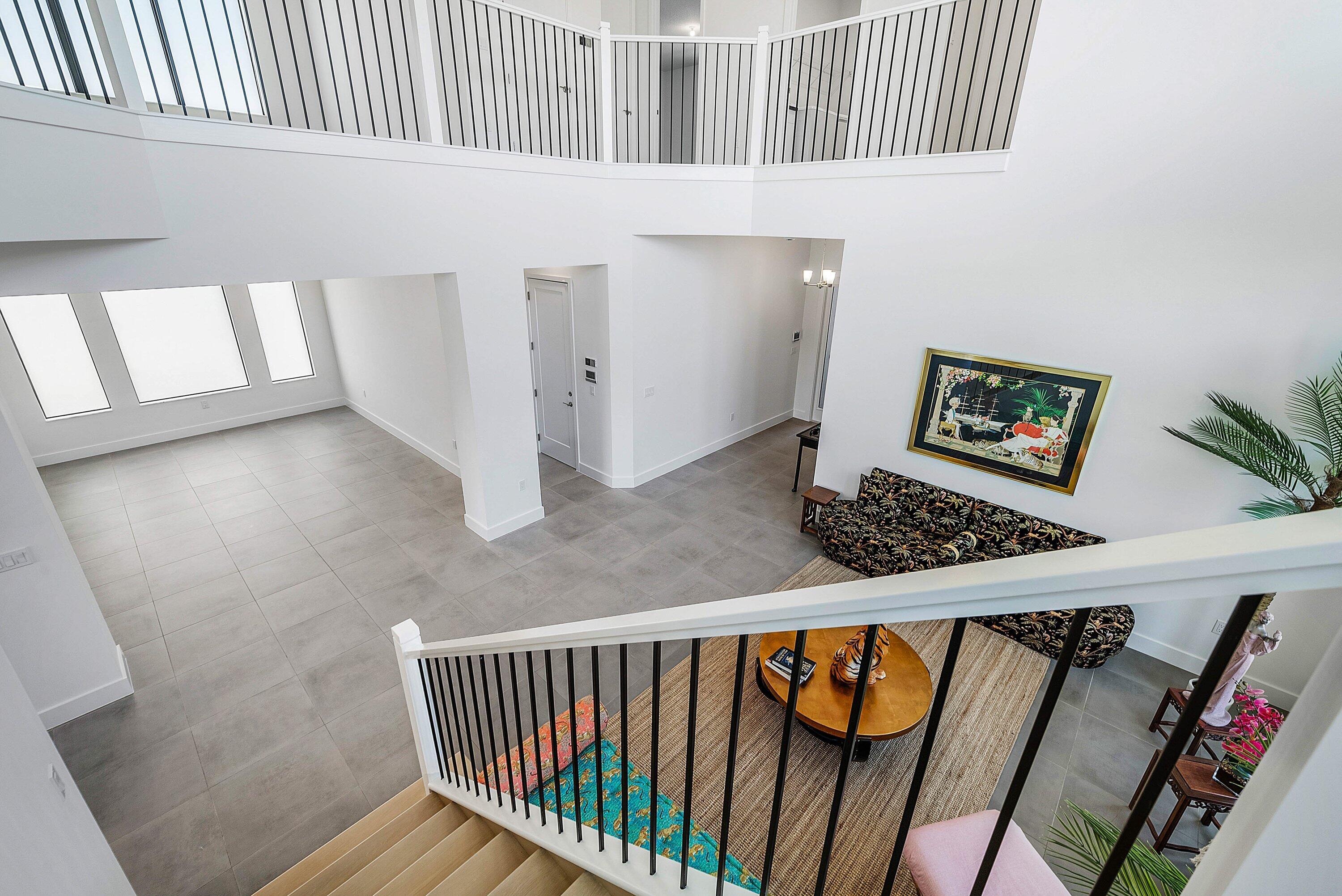 8260 Royal County Down Road Boca Raton, FL 33434 - Photo 39 of 115 a view of staircase with white walls and a window