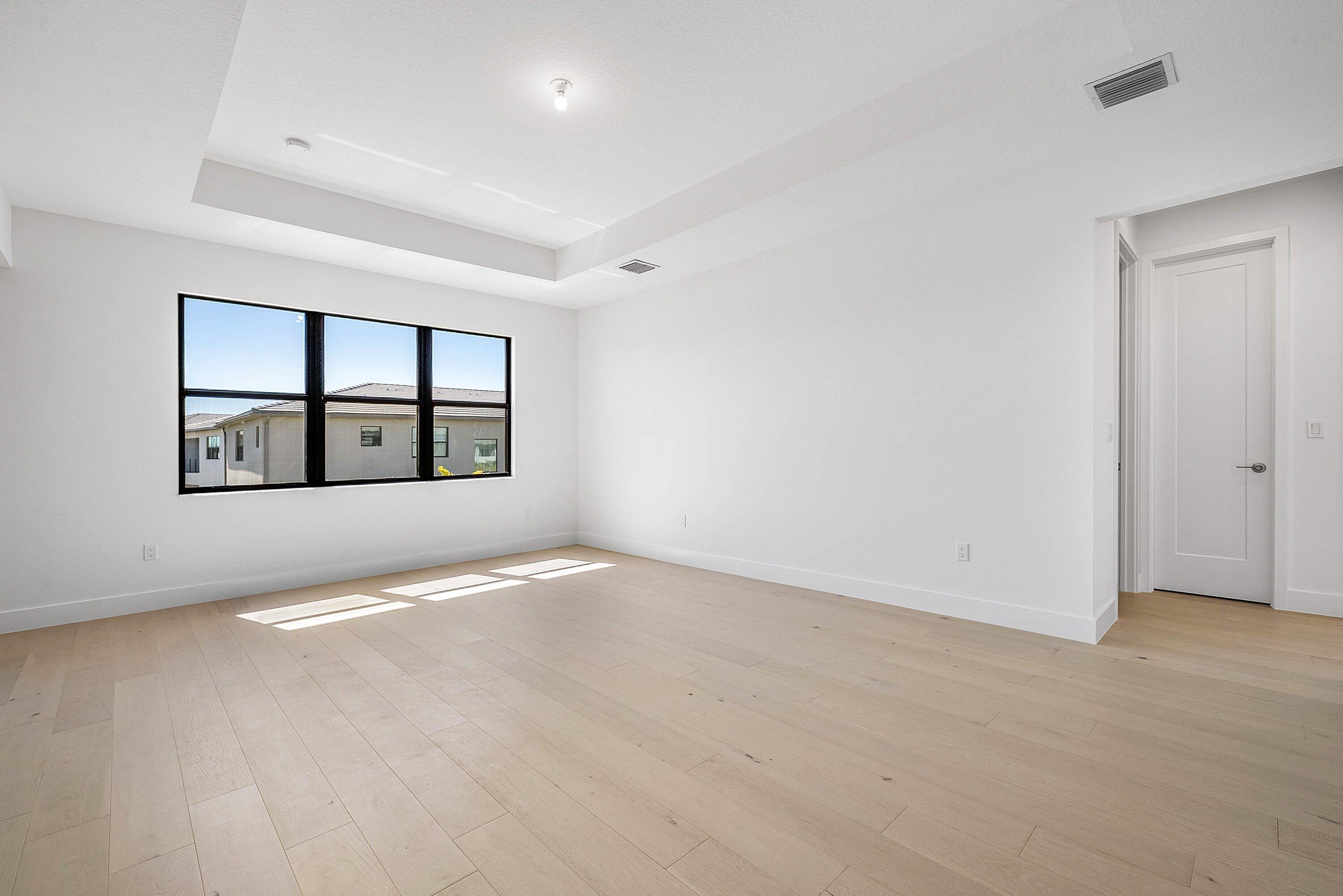 8260 Royal County Down Road Boca Raton, FL 33434 - Photo 44 of 115 an empty room with windows and white walls