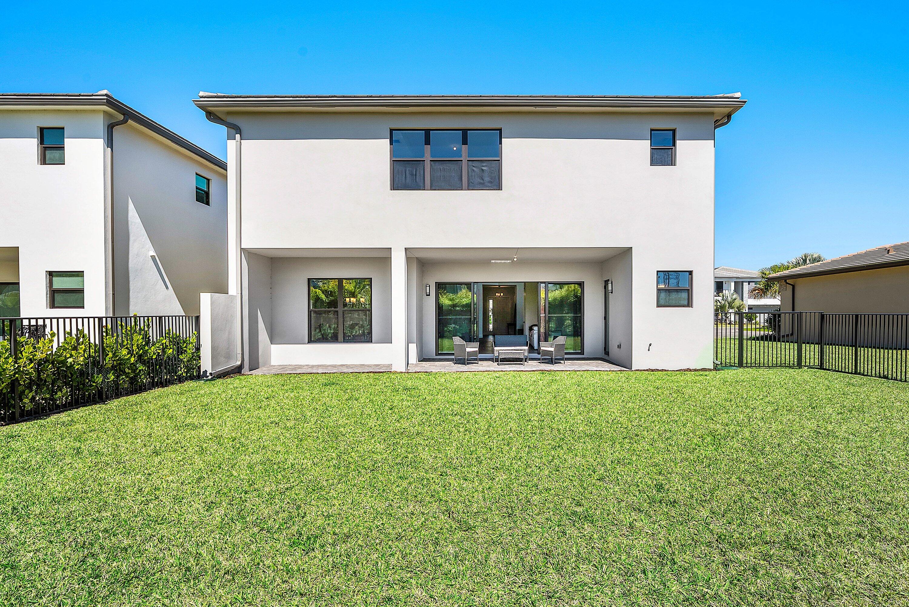 8260 Royal County Down Road Boca Raton, FL 33434 - Photo 56 of 115 a view of an house with backyard space and garden