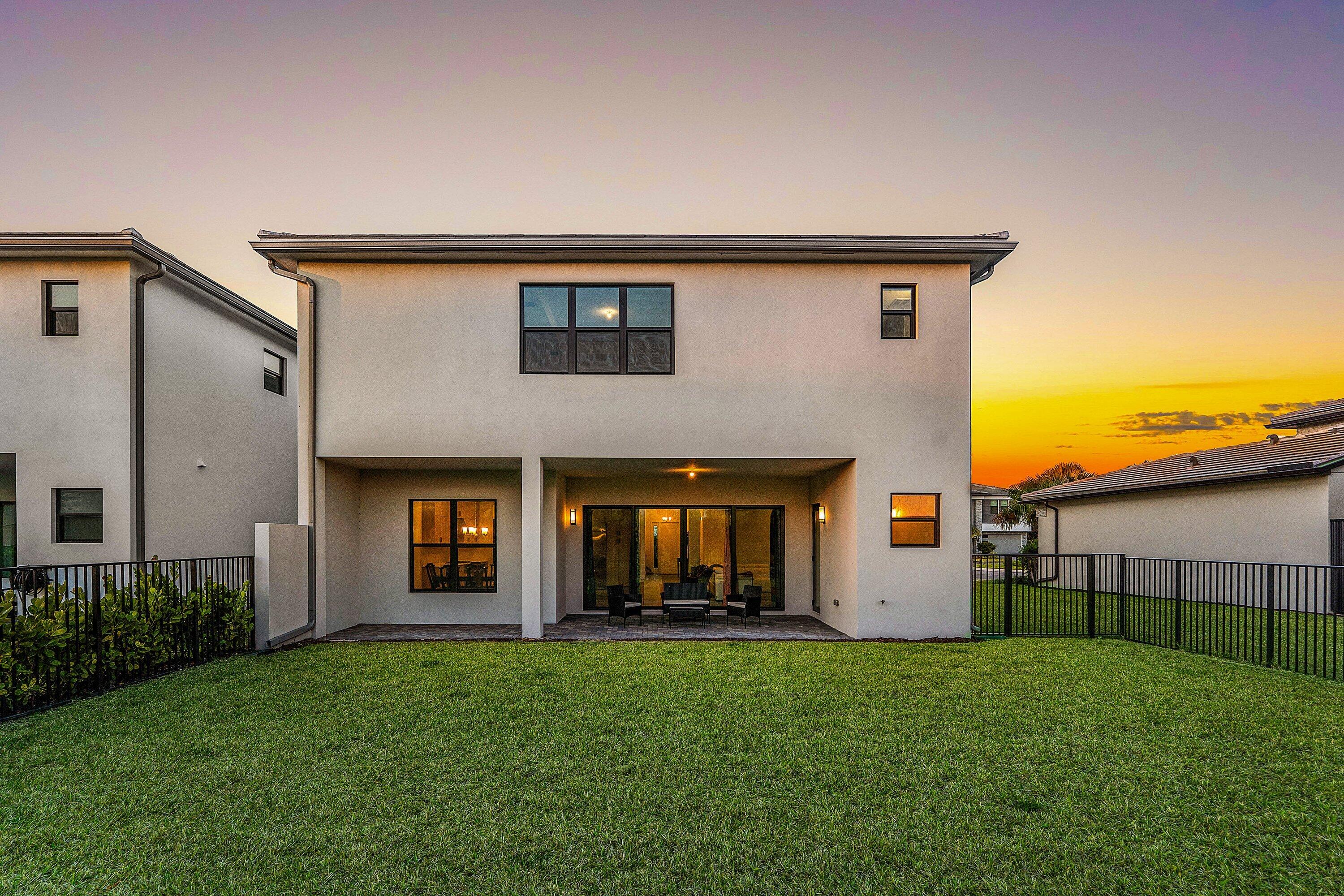 8260 Royal County Down Road Boca Raton, FL 33434 - Photo 78 of 115 a front view of a house with a yard