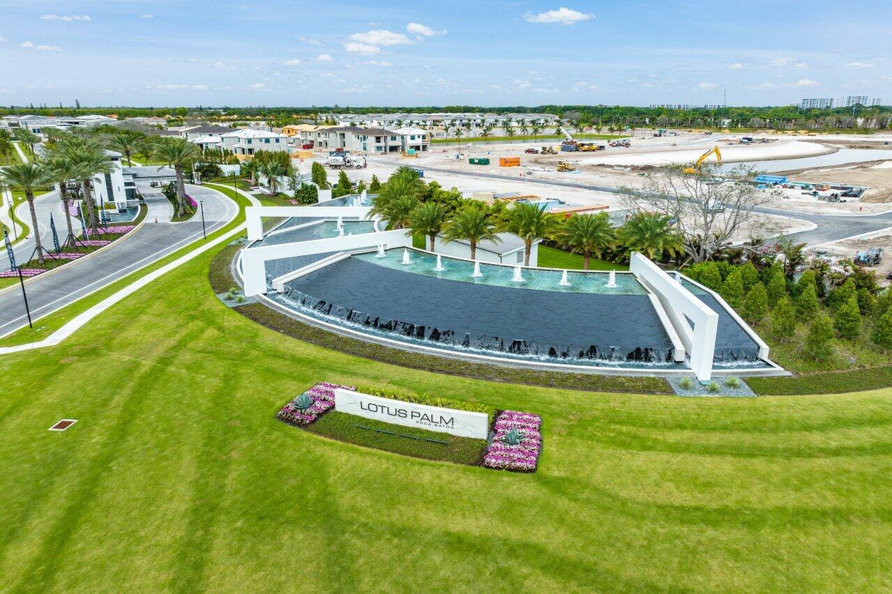 8260 Royal County Down Road Boca Raton, FL 33434 - Photo 87 of 115 a view of a swimming pool with an outdoor seating and a yard