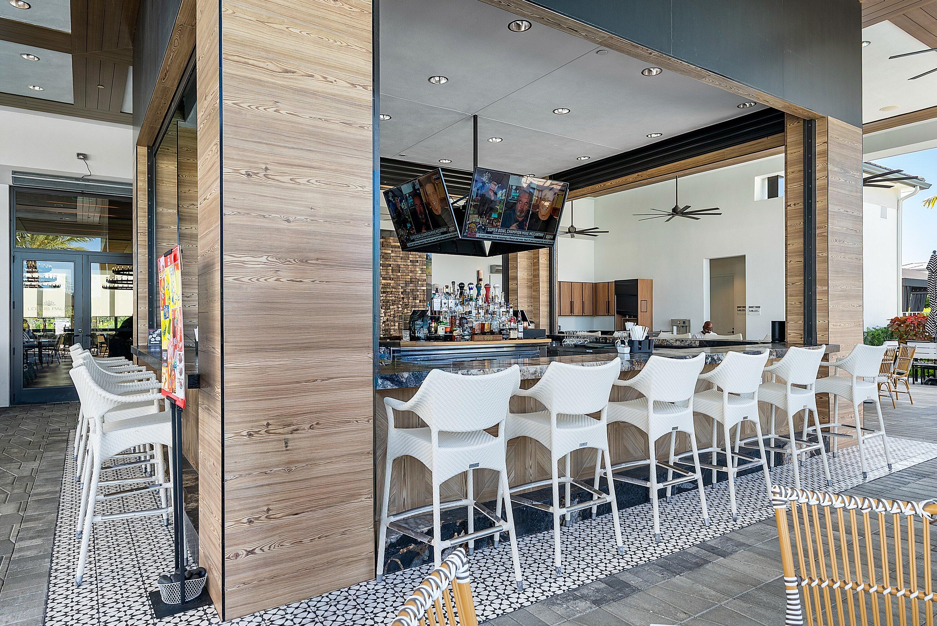 8260 Royal County Down Road Boca Raton, FL 33434 - Photo 100 of 115 a group of people sitting in center of a building