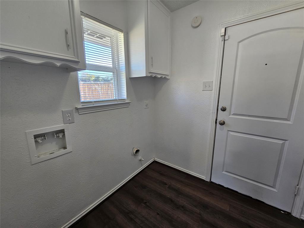 2400 Meadow Creek Drive Carrollton, TX 75006 - Photo 13 of 33 a view of storage and utility room with wooden floor and window