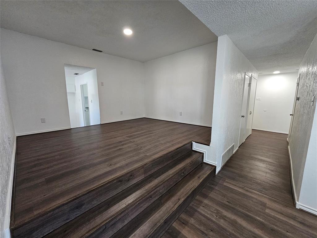 2400 Meadow Creek Drive Carrollton, TX 75006 - Photo 15 of 33 wooden floor in an empty room