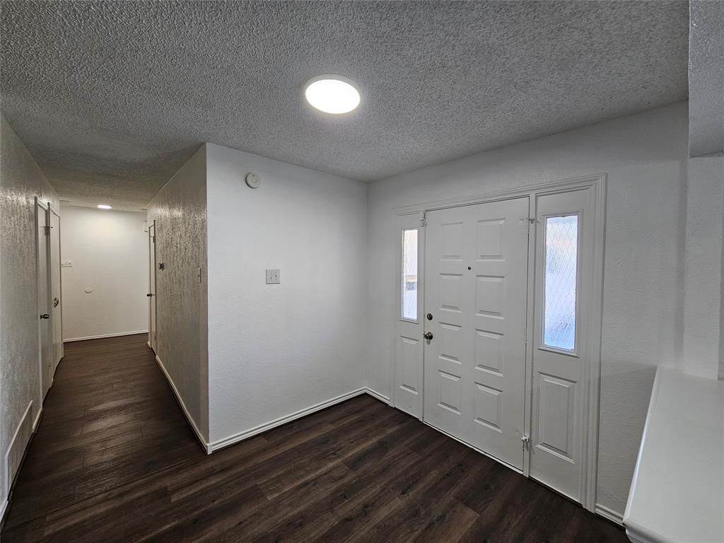 2400 Meadow Creek Drive Carrollton, TX 75006 - Photo 2 of 33 a view of empty room with wooden floor