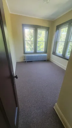 a view of an empty room with windows