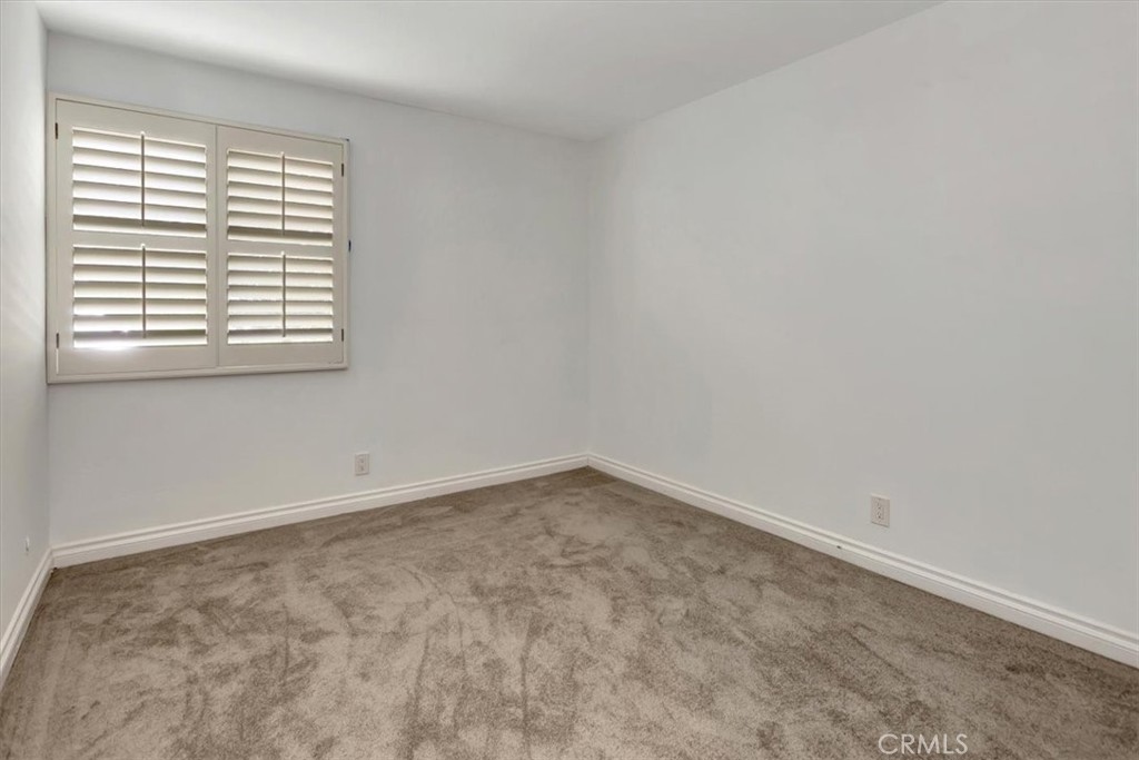 363 Ravello Lane Costa Mesa, CA 92627 - Photo 12 of 22 an empty room with a window