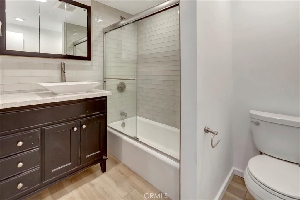 363 Ravello Lane Costa Mesa, CA 92627 - Photo 13 of 22 a bathroom with a sink a toilet and shower