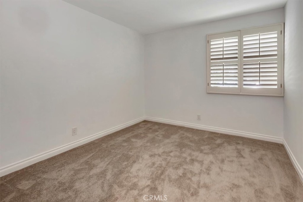 363 Ravello Lane Costa Mesa, CA 92627 - Photo 14 of 22 an empty room with a window