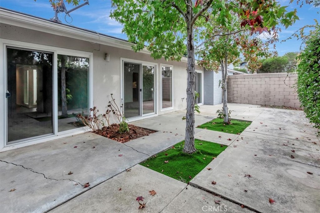 363 Ravello Lane Costa Mesa, CA 92627 - Photo 16 of 22 a front view of a house with a patio