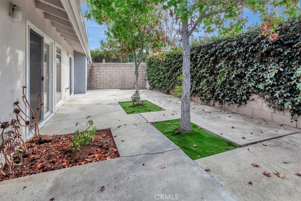 363 Ravello Lane Costa Mesa, CA 92627 - Photo 17 of 22 a view of a house with a yard