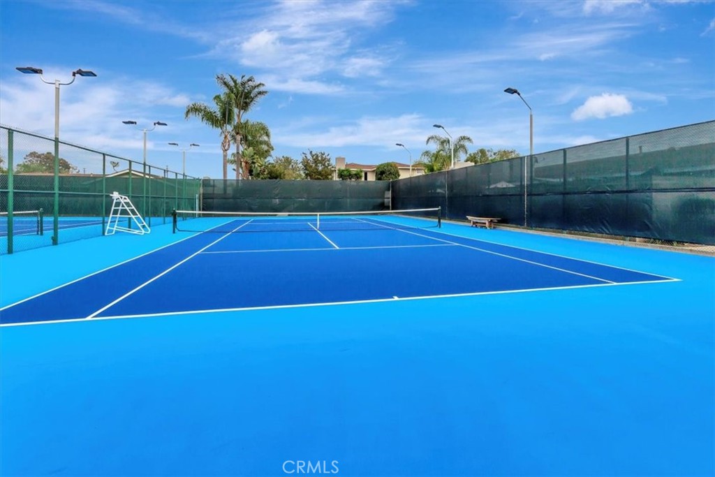363 Ravello Lane Costa Mesa, CA 92627 - Photo 19 of 22 a view of a tennis court