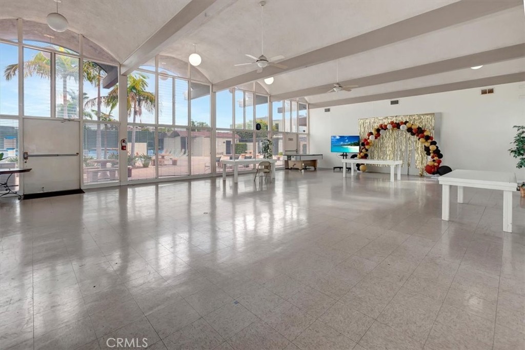 363 Ravello Lane Costa Mesa, CA 92627 - Photo 20 of 22 a living room with furniture and a large window