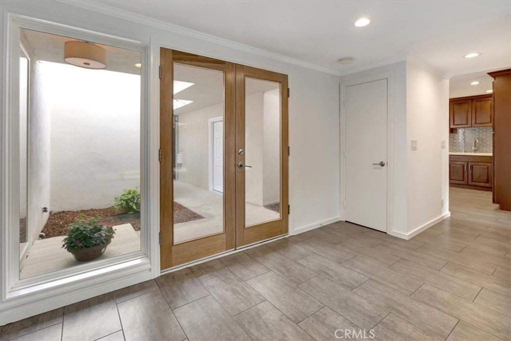 363 Ravello Lane Costa Mesa, CA 92627 - Photo 3 of 22 a view of entryway with wooden floor