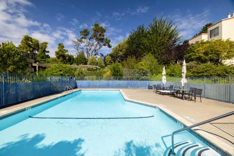 a view of a swimming pool with a patio