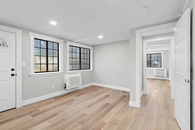wooden floor in an empty room with a window